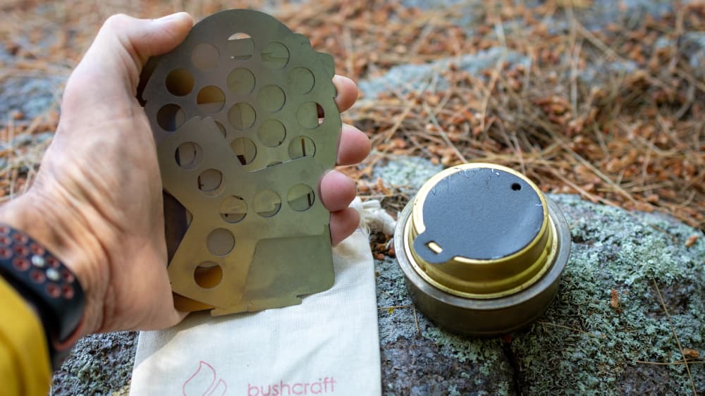 Bushbox Ultralight Pocket Stove Folded Up on a Rock