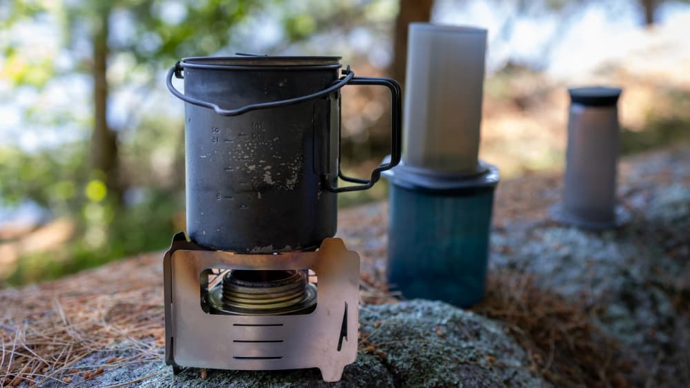 Bushbox Ultralight Stove being used to boil a pot of water